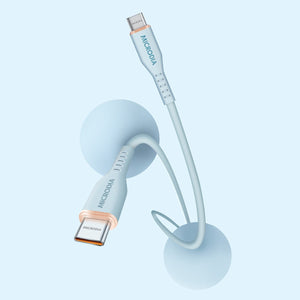 MICRODIA Fruitywire light blue liquid silicon USB-C to USB-C 60W fast charging cable with rose gold connector accents.